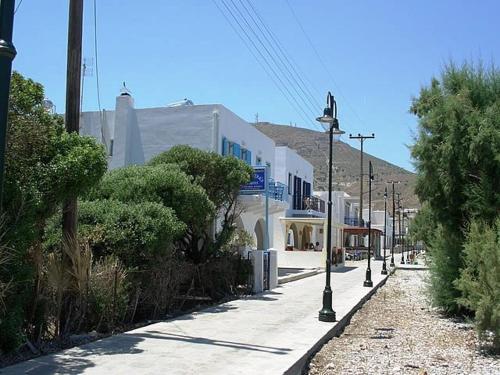 a street with buildings and street lights and trees at Kleopatra's Rooms in Livadia