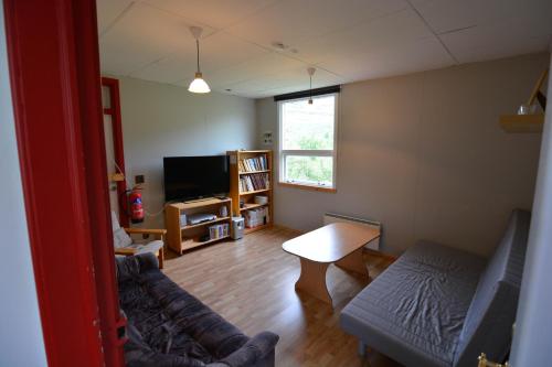 Sjónvarps- og/eða afþreyingartæki á Bragdavellir Holiday Home