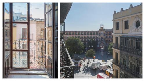 a view of a city from a balcony of a building at Hostal Centro in Toledo