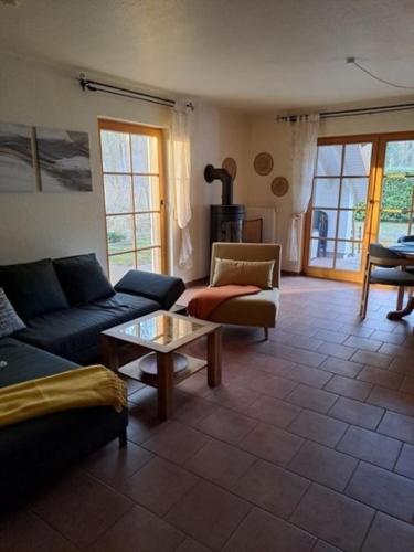 a living room with a couch and a table at Schwalbenweg in Zingst