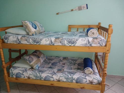 two bunk beds in a room with pillows at Afsaal 214 in Amanzimtoti