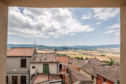 a view of roofs of buildings in a town at Incanto apartment in Laiatico