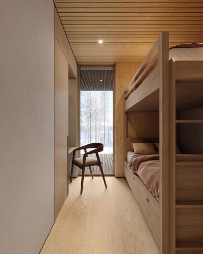 a bedroom with a bunk bed and a desk at Inai Haven in Ivalo
