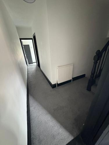 an overhead view of an empty room with a stairway at Refurbished 4-Bed Home Near Hospital & Station in Chatham