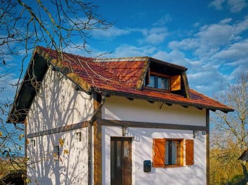 a small white house with a red roof at Villa S&S 