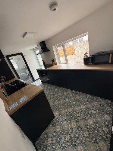 a view of a room with a counter and a room with a room at Refurbished 4-Bed Home Near Hospital & Station in Chatham