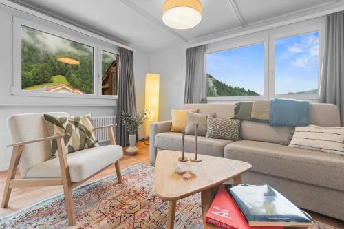 a living room with a couch and a table at Ferienwohnung 'Bergkristall' in Schiers