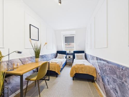 Postel nebo postele na pokoji v ubytování ApartamentySnu, Jagielloński Penthouse