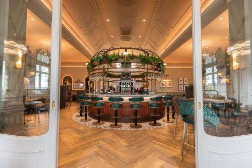 a bar in the middle of a room with tables and chairs at Crieff Hydro Self Catering in Crieff