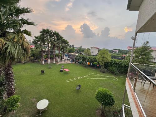 an aerial view of a yard with a playground at Mannat Farms in Noida