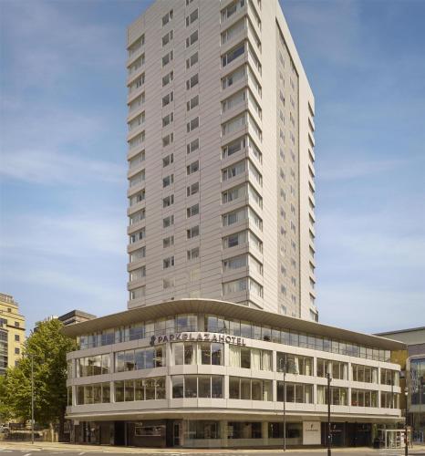 a tall white building with a building at Park Plaza Leeds in Leeds
