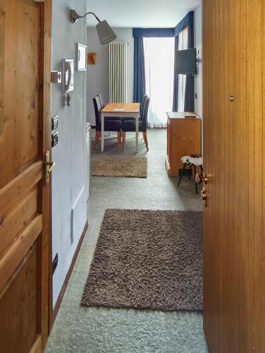 a room with a table and a dining room at Shackleton Chalet in Sestriere
