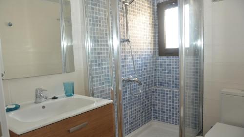 a bathroom with a shower with a sink and a toilet at Apt. El Molino 3A in Valle Gran Rey