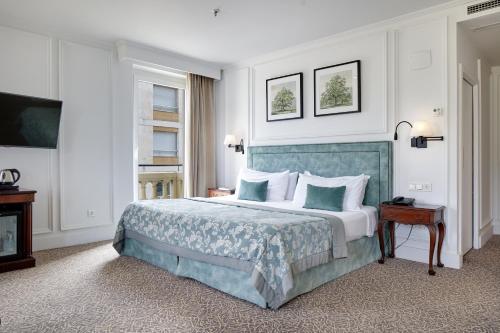 Katil atau katil-katil dalam bilik di Hotel de Londres y de Inglaterra