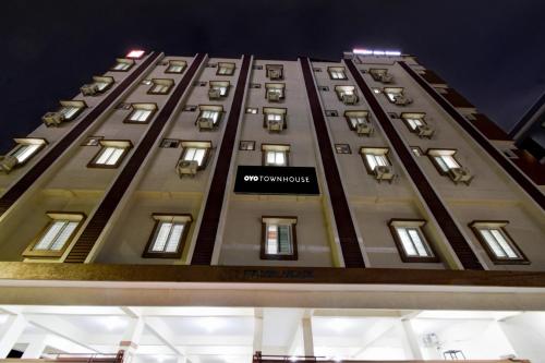 a tall building with a no smoking sign on it at Super Townhouse Oak Bachupally Medical College Formerly SV Hotels in Lingampalli