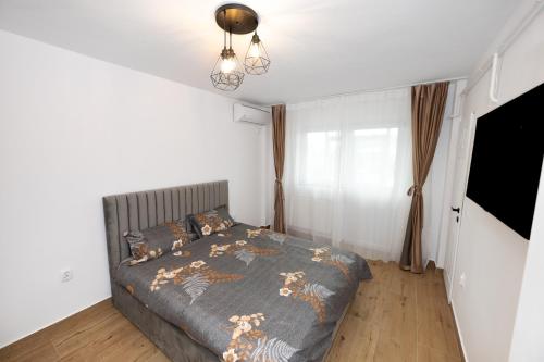 Postel nebo postele na pokoji v ubytování Sunset Studio Valcea
