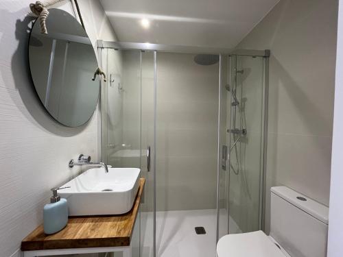 a bathroom with a sink and a shower at COACH HOUSE by SOM Menorca in Son Parc