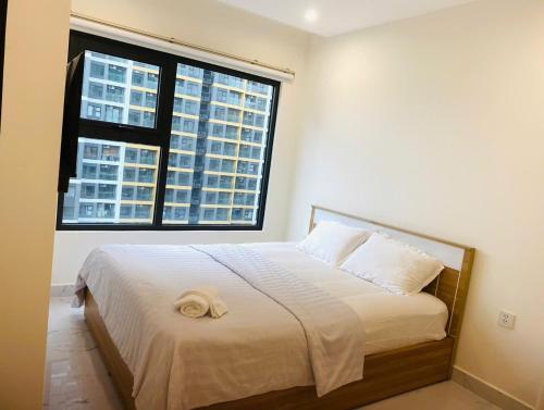 Ένα ή περισσότερα κρεβάτια σε δωμάτιο στο CH Studio Vinhome Grand Park Quận 9 - TP Thủ Đức