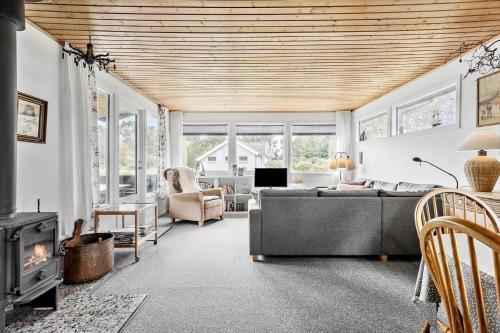 a living room with a couch and a fireplace at 912-Thisted-Astien-17 in Torsted