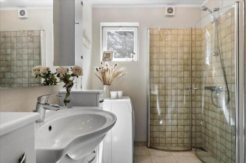 a bathroom with a shower and a sink and a shower at 406-Vestervig-Bekkasinvej-6 in Vestervig