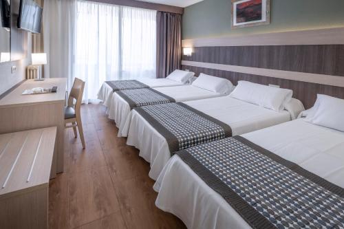 Кровать или кровати в номере 4R Playa Park