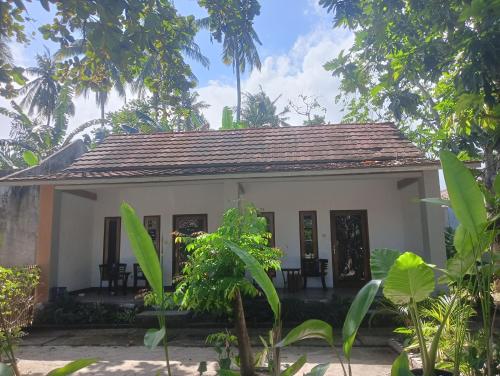 a small house in the middle of a forest at BATARA Homestay in Kuta Lombok