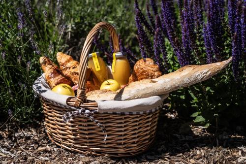 a basket filled with bread and other foods at La Perle de Domme in Sarlat-la-Canéda