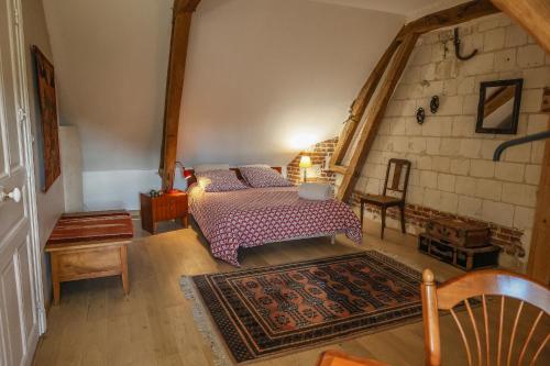 Katil atau katil-katil dalam bilik di Gîte cosy, champêtre, classé 3 étoiles Le bout du L