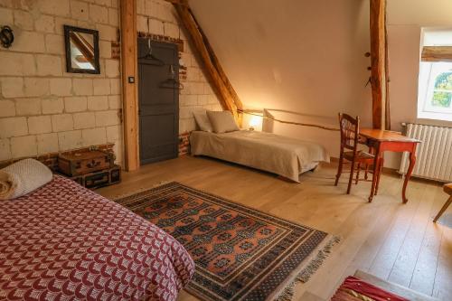 Katil atau katil-katil dalam bilik di Gîte cosy, champêtre, classé 3 étoiles Le bout du L