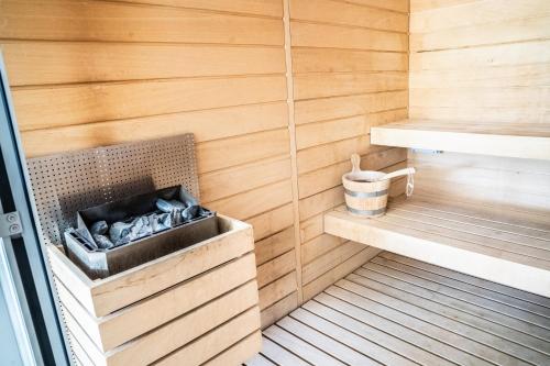 a sauna with wood paneling and a wooden wall at La Perle de Domme in Sarlat-la-Canéda