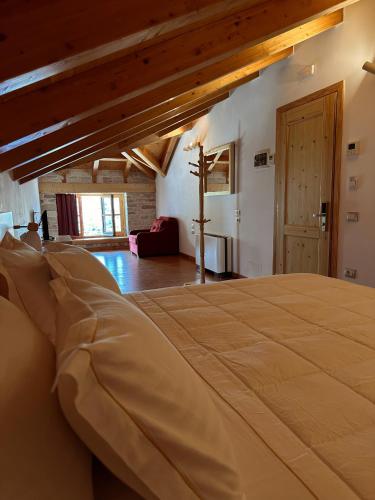 a bedroom with a large bed in a room at Kalemi Twin Boutique Hotel in Gjirokastër