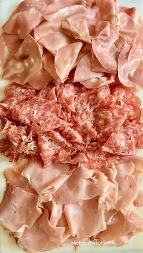 a pile of meat sitting on a plate at Hotel Astoria in Torri del Benaco