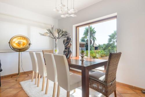 a dining room with a table and chairs at Tranquil Haven in Ibiza City, 1254 in Sant Francesc de s'Estany