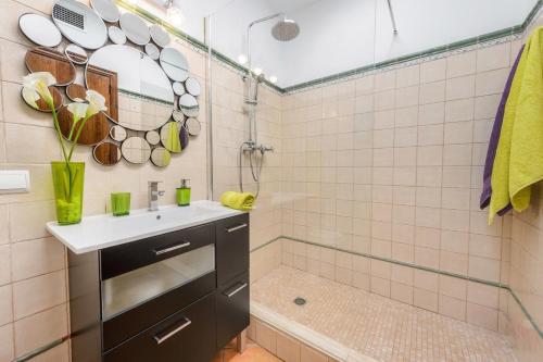 a bathroom with a sink and a shower at Tranquil Haven in Ibiza City, 1254 in Sant Francesc de s'Estany