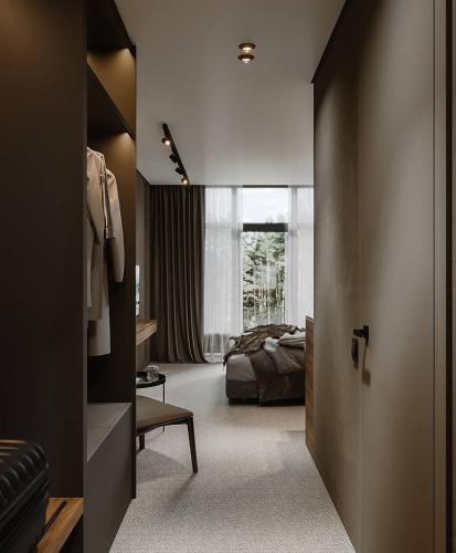 a bedroom with a bed and a window and a door at Wood Hotel Resort & SPA in Bukovel