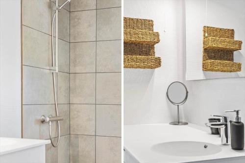 a bathroom with a shower and a sink and a mirror at 132-Thisted-Sotungevej-31 in Thisted