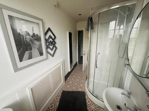 a bathroom with a shower and a sink at horn and trumpet in Bewdley