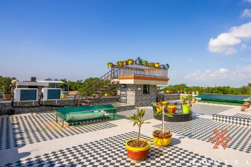 a pool with a water slide on the roof at Zostel Agra in Agra