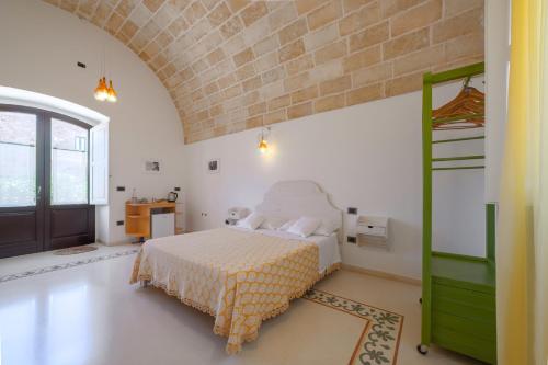 Ένα ή περισσότερα κρεβάτια σε δωμάτιο στο Masseria Galatea Agriturismo