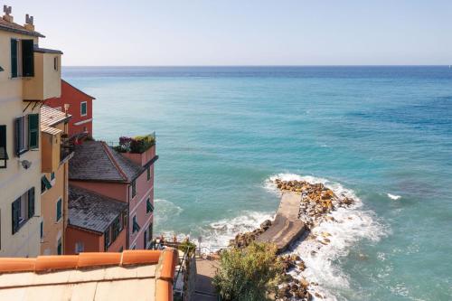 an aerial view of the ocean between two buildings at Newly Renovated Ocean View Flat in Sori