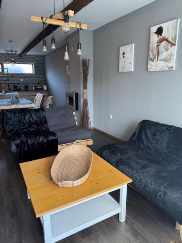a living room with a couch and a table at Boris’s Guest Apartment in Chepelare