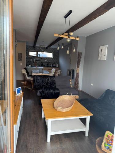 a living room with a couch and a table at Boris’s Guest Apartment in Chepelare