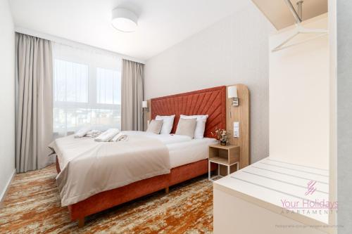 Your Holidays Bel Mare 107 Fにあるベッド