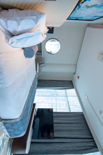 an overhead view of the inside of an airplane cabin at Century Marina Hotel - Lusail in Lusail