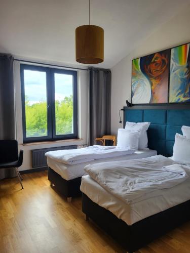 Postel nebo postele na pokoji v ubytování Palac i Loft Ojrzanów