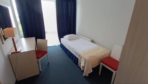 Postel nebo postele na pokoji v ubytování Optima Pochayiv