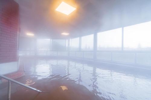 a large pool of water in a building at May Termal Pamukkale in Pamukkale