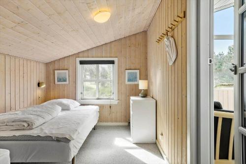 a bedroom with a bed and a window at 788-Thisted-Blamunkevej-46 in Thisted