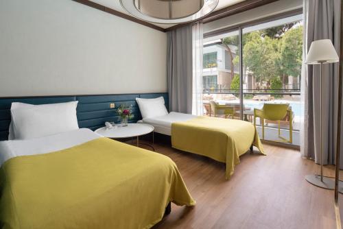 En eller flere senge i et værelse på Voyage Belek Golf & Spa Hotel