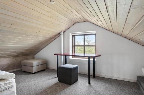 a room with a table and a window in a attic at 890-Snedsted-Niels-Juels-Vej-41 in Snedsted
